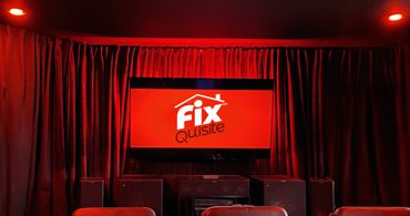 Custom home theater install with synced lighting, sound, and seat transducers.