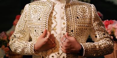 Groom in an ivory mirrorwork sherwani by House of Shwet, styled for a grand sangeet soiree
