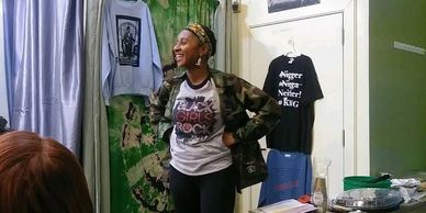 Black Owned Woman Business Owner selling Unique Black Power t-shirts for women, men, and children at our store The Movement, 7133 Germantown Avenue.  Black Girls Rock!  Tupac, Nina Simone, Barack Obama, Huey Newton