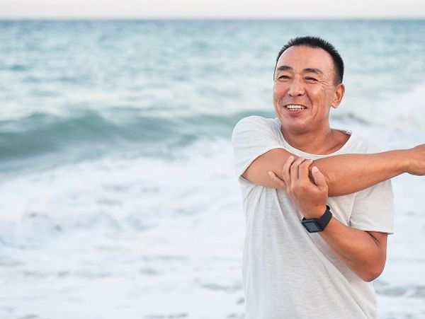 medium-shot-smiley-man-stretching-arm