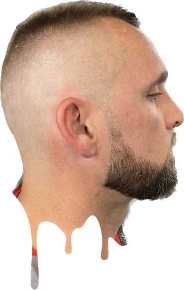 Profile of a man with a fade haircut and sculpted beard, with a dripping paint effect at the bottom.