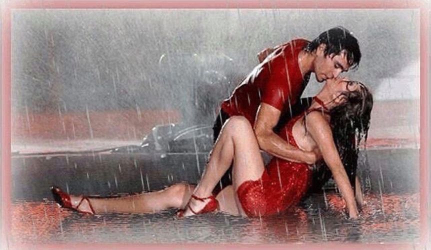 Couples dancing closely together on a lively dance floor under colorful lights.