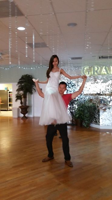 Rehearsal wedding dance, dance lesson, man lifting woman onto his shoulder, dance lift, private less