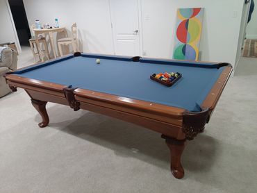 Academy Blue Championship Invitational cloth on an AMF pool table