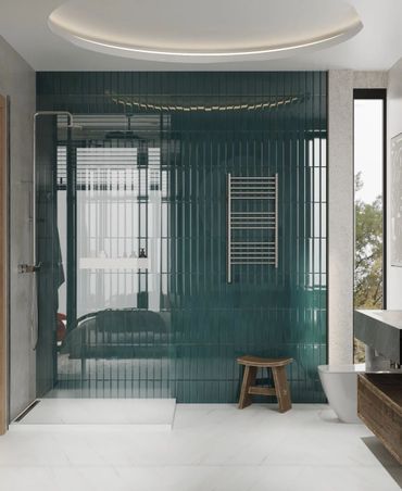 Modern bathroom with green tiled shower wall and wooden stool.