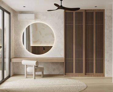Minimalist dressing area with round mirror, modern chair, and wooden wardrobe.