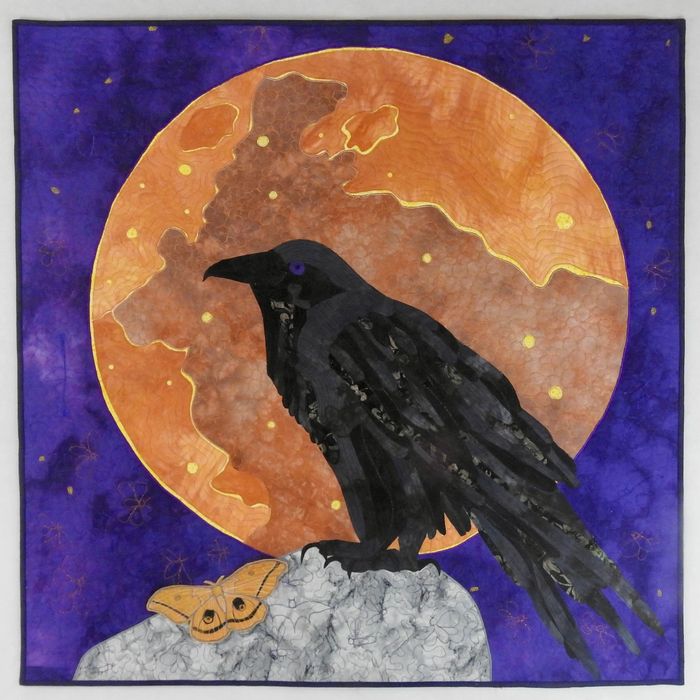 Quilt of a raven over a blood moon.