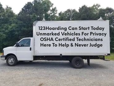 123hoarding.com company trucks with cleaning services written on the side of the truck