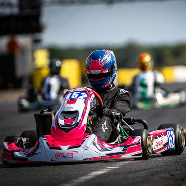 Go-kart racer in action on the track.