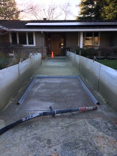Containment set up for removing paint on exposed aggregate walkway in Stockton, CA