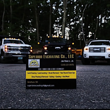 Business card for Superior Excavating Co., LLC with trucks in the background.