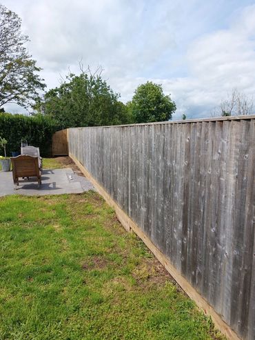 6ft repaired feather board fence