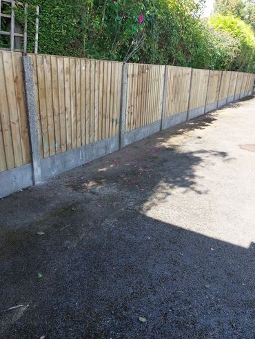 4ft feather board panels with concrete gravel boards