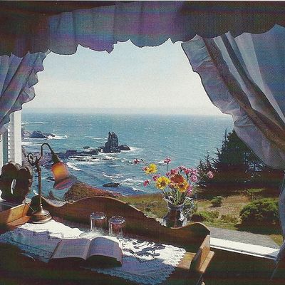 An open window overlooking a sea cliff