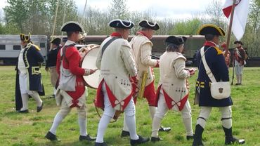 Fife & Drum Corp march and play instruments on the battlefield.