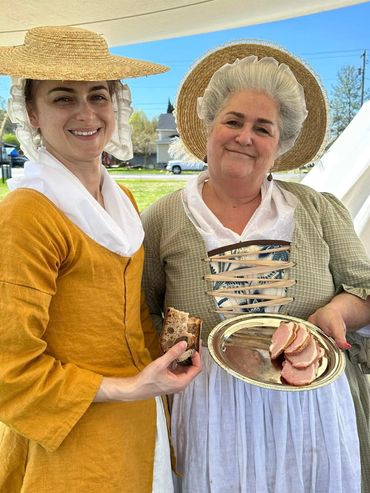 Colonial women in a camp tent.