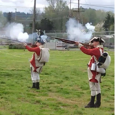43rd Regiment of Foot soldiers fire muskets on the battlefield.