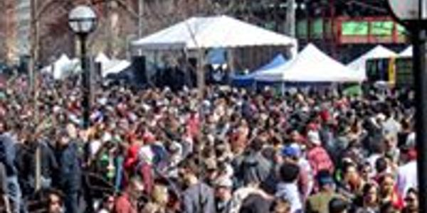 Thousands of people look upon the stage from afar.