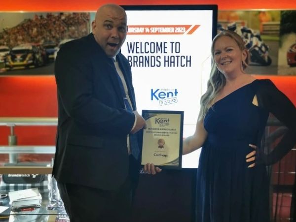 Trish and Andy with an award