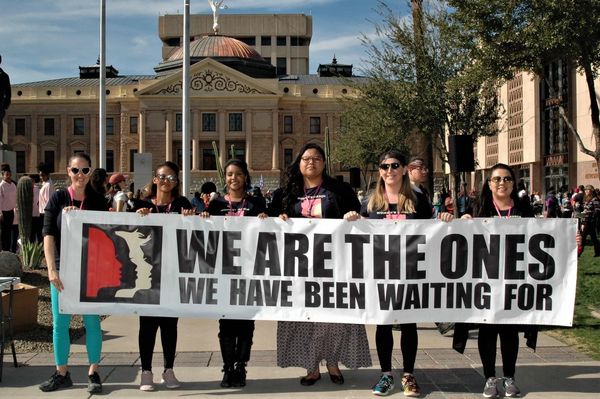 Brianna Westbrook, a co-organizer of the Women's March, stands in front of the Arizona Capitol.