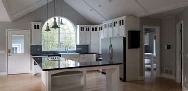 blue and white kitchen with white painted cabinets