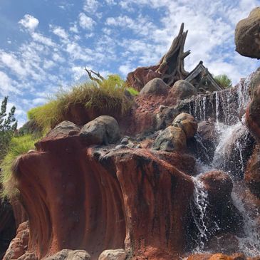 Splash Mountain water fall at Disneyland, with a blue sky