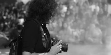 Photographer filming an event, preserving key moments, for unforgettable memories