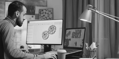 Professional animating logo design on computer for brand identity.