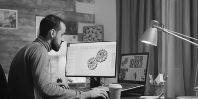 Designer creating explainer video on computer, turning complex ideas into engaging visual stories.