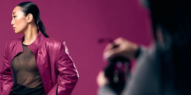 Fashion: Photographer with a model in a purple jacket, showcasing style and elegance for promotion