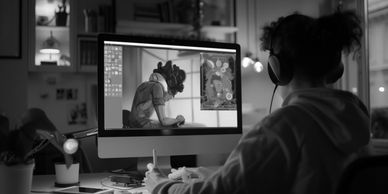 Creator developing animated content for social media on computer screen.