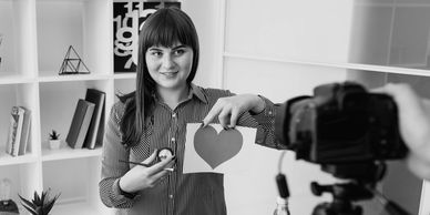 Ad Photography: Photographer shooting a model with a camera, creating eye-catching images