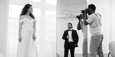 Photographer capturing a bride and groom, connecting clients for cherished moments.