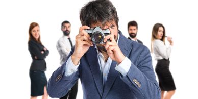 Corporate Photography: Photographer with a business group, corporate events and branding.