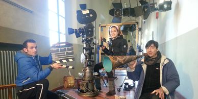 Cinematographer with his crew in the location before ad film shoot.