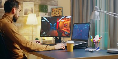 Creator designing social media content with animated visuals on computer.