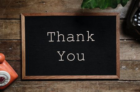 Small blackboard with the words thank you written on it