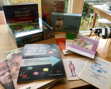 Assortment of Danish books on grief