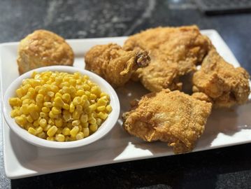 Broasted chicken with corn and biscuit