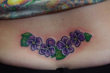 Color purple flowers tattoo.