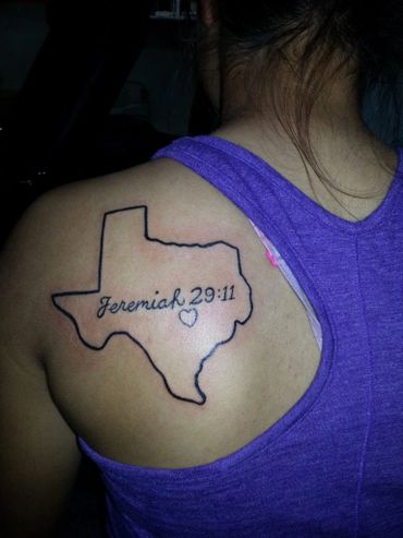 Black and grey tattoo of Texas with Bible quote lettering.