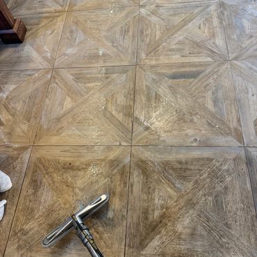 Deep linoleum floor cleaning removing buildup from residential flooring surfaces.