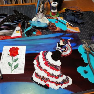 Textured stained glass art study by Susan Lorenzana of flamenco dancer with fan and rose