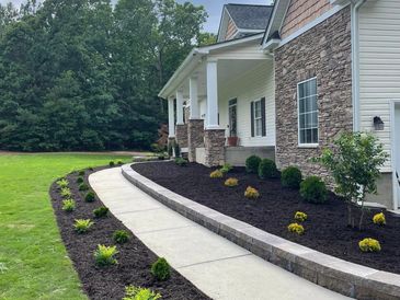 Complete landscaping sod, retaining wall, shrubs ,and mulch