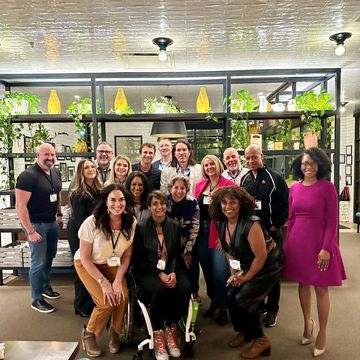 Professional speakers in a development program focused on coaching, community, and lasting impact