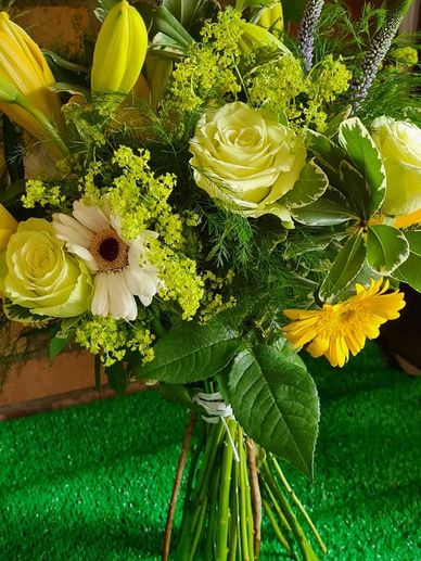 Yellow lily's and green roses with snoopy gerbra |Fresh and zingy