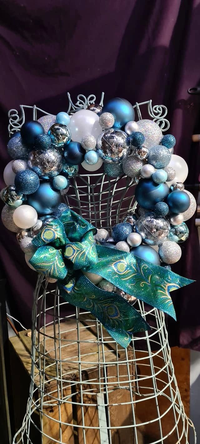 Blue White and Silver Bauble wreath finished with a peacock feather ribbon and bow