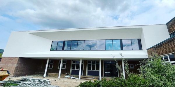 Thin coat render on Frankin College Grimsby