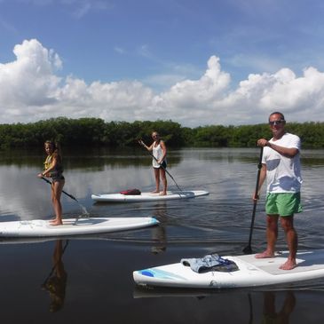 Family paddleboarding in Coopers Bayou