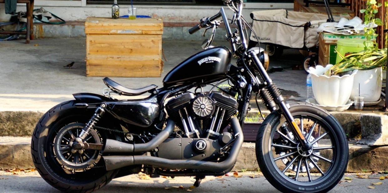 Black Harley Davidson motorcycle parked outdoors.